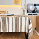 Patterned tablecloth on a dining table in a kitchen setting