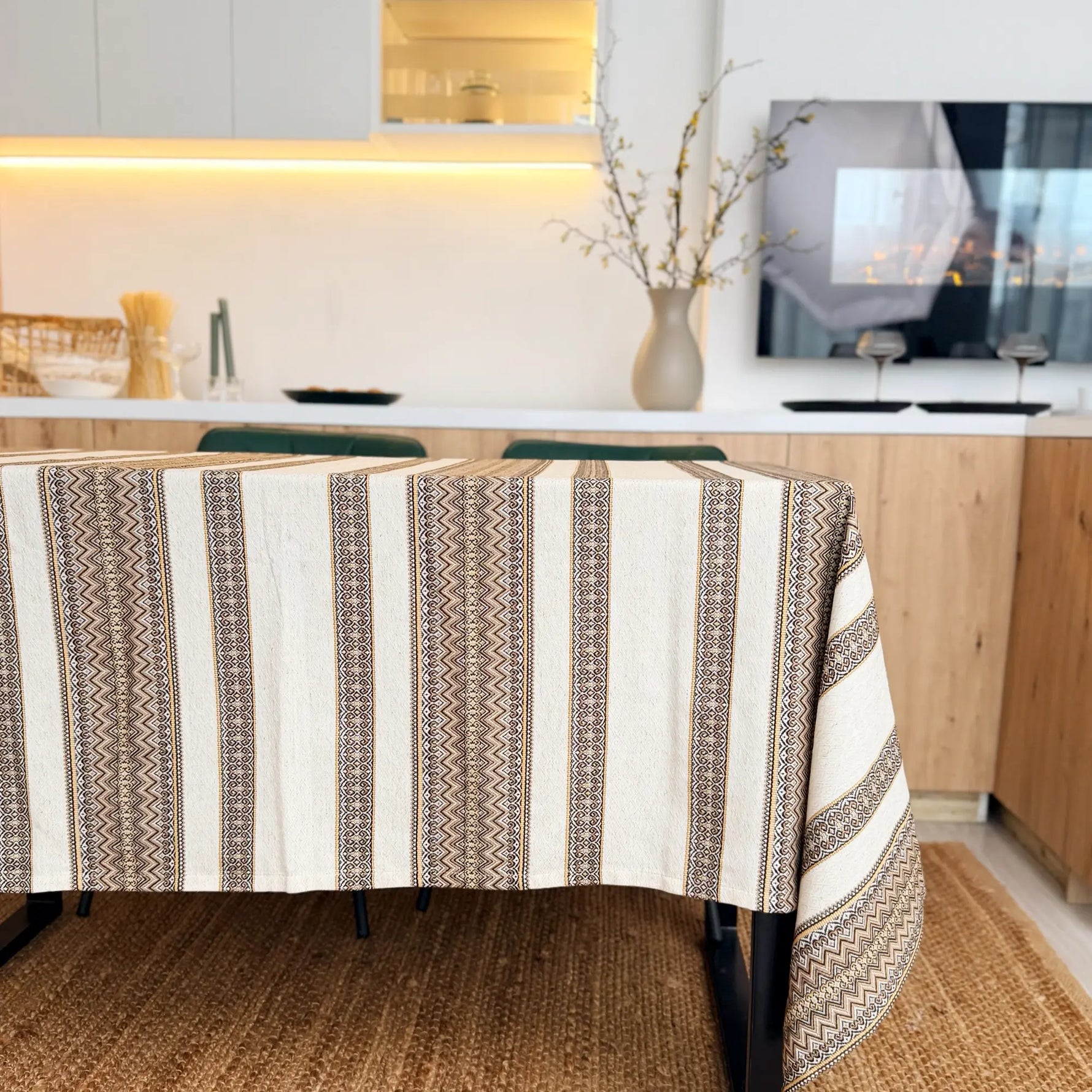 Patterned tablecloth on a dining table in a kitchen setting