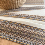 Striped fabric with zigzag pattern on a wooden surface
