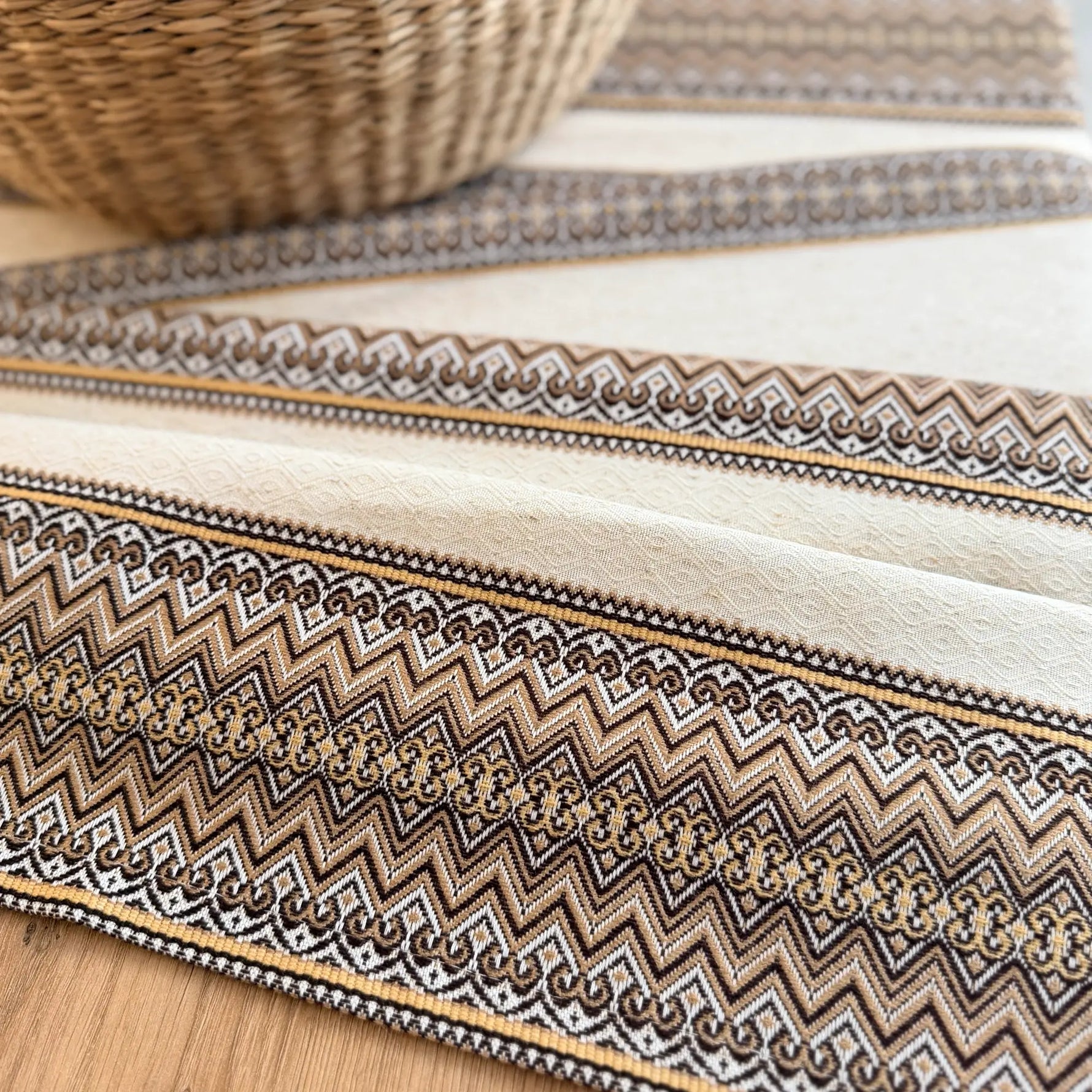 Striped fabric with zigzag pattern on a wooden surface