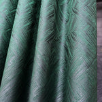 Close-up of green textured fabric with a geometric pattern