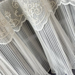 Decorative sheer curtain with intricate lace ruffle detailing