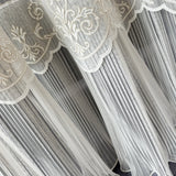Decorative sheer curtain with intricate lace ruffle detailing