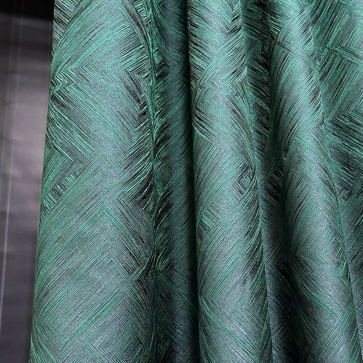 Close-up of green textured fabric with a pattern