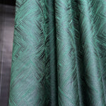 Close-up of green textured fabric with a pattern