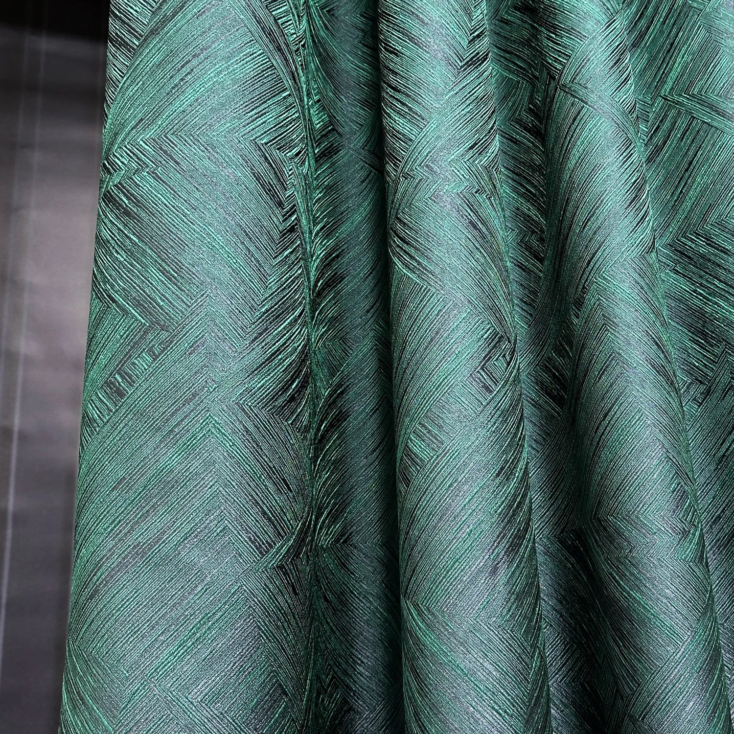 Close-up of green textured fabric with a pattern