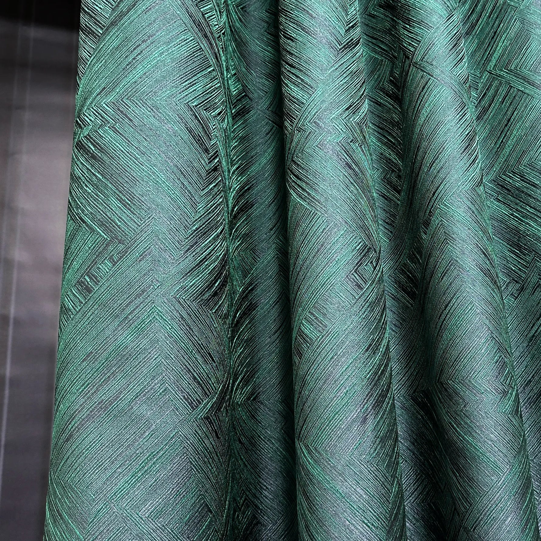 Close-up of green textured fabric with a pattern