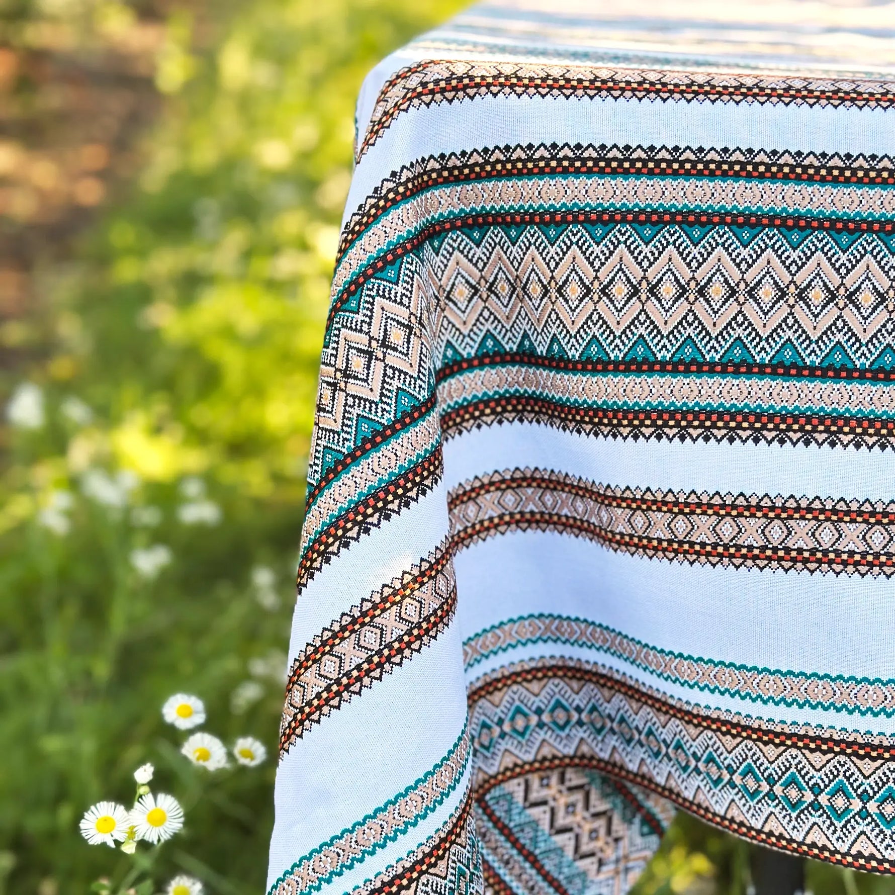 Patterned fabric with a blurred natural background