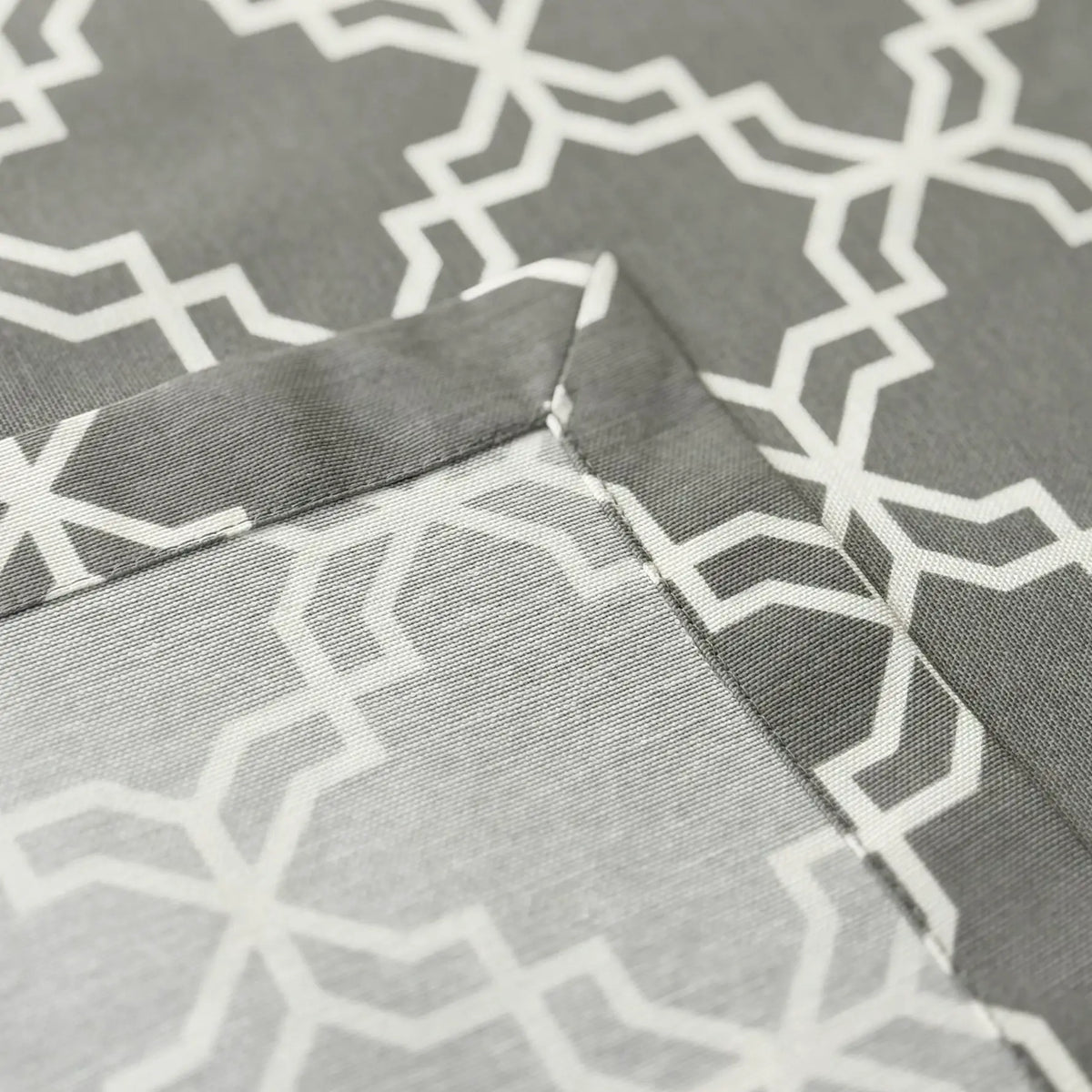 Close-up of gray fabric with white geometric pattern