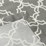 Close-up of gray fabric with white geometric pattern