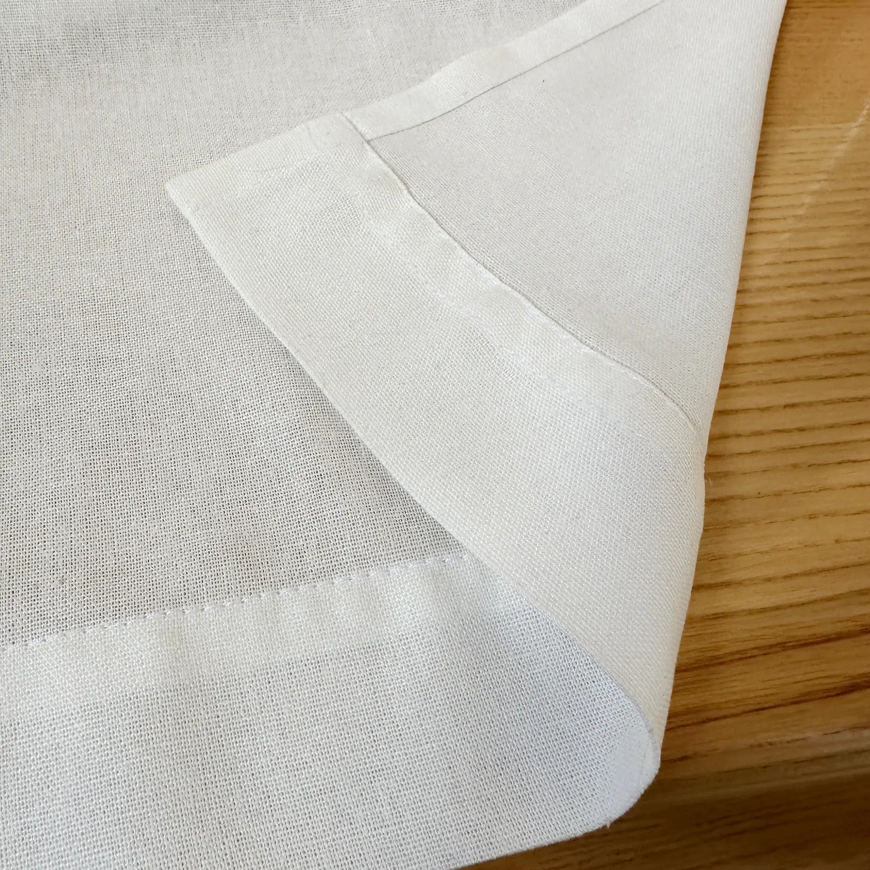 Close-up of white fabric on a wooden surface