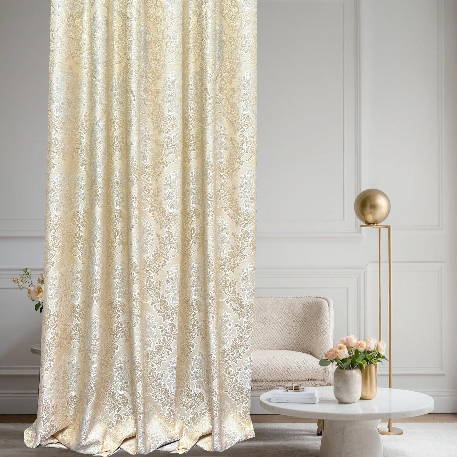 Decorative beige curtain in a stylish room with a chair and table.