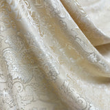 Ivory beige jacquard curtain fabric sample with floral damask texture