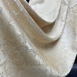 Ivory beige jacquard curtain fabric sample with floral damask texture
