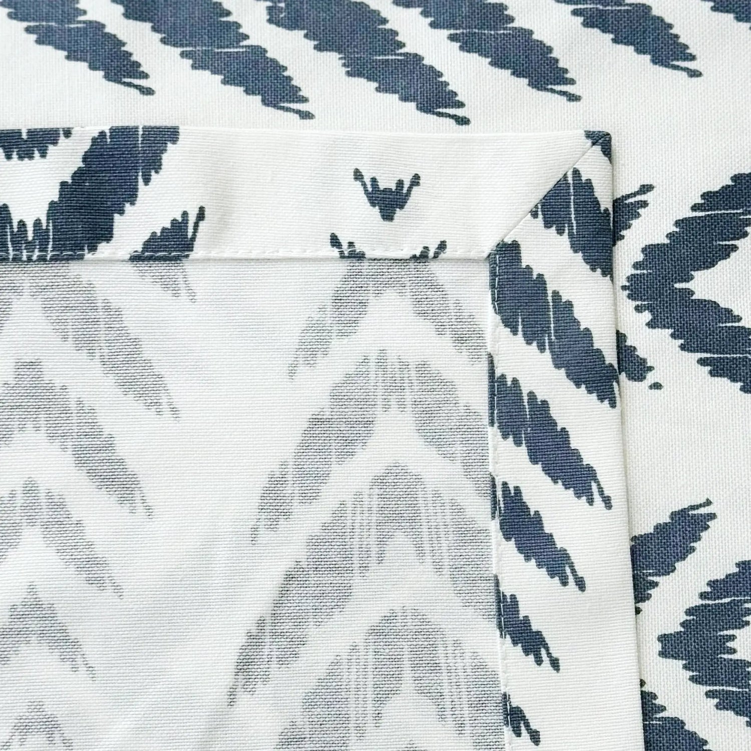 Fabric with blue and gray abstract pattern on a white background