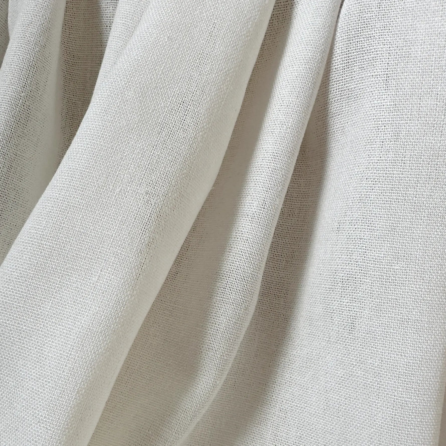 Close-up of beige fabric with visible texture