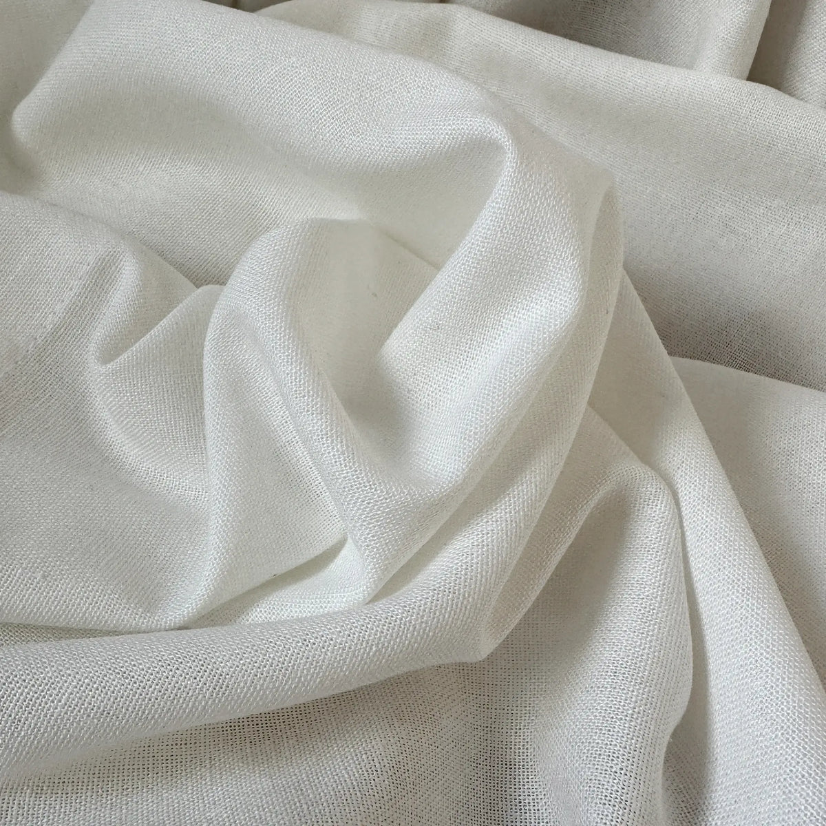 Close-up of beige fabric with folds