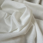 Close-up of beige fabric with folds