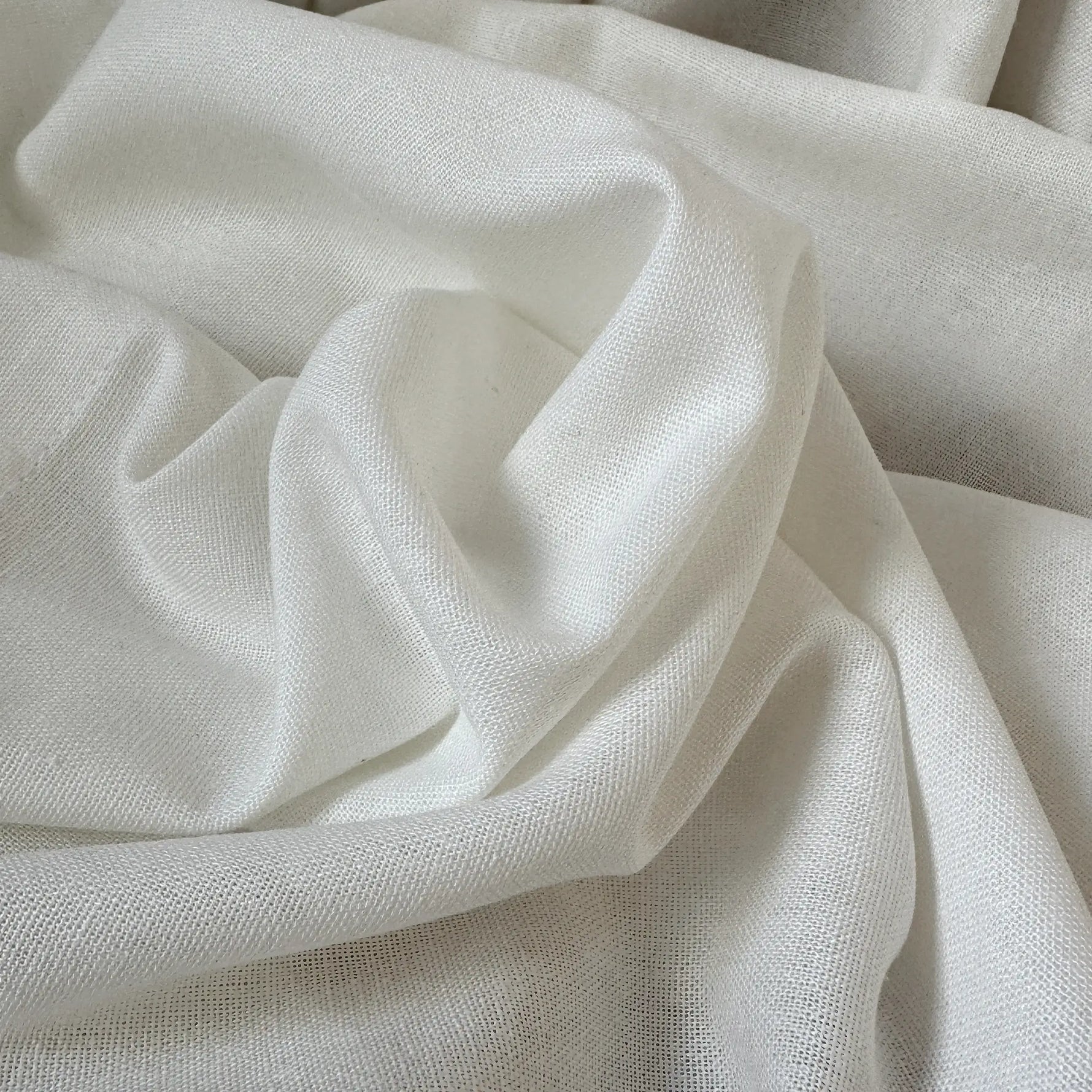 Close-up of beige fabric with folds