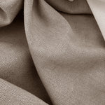 Close-up of beige fabric with a textured pattern