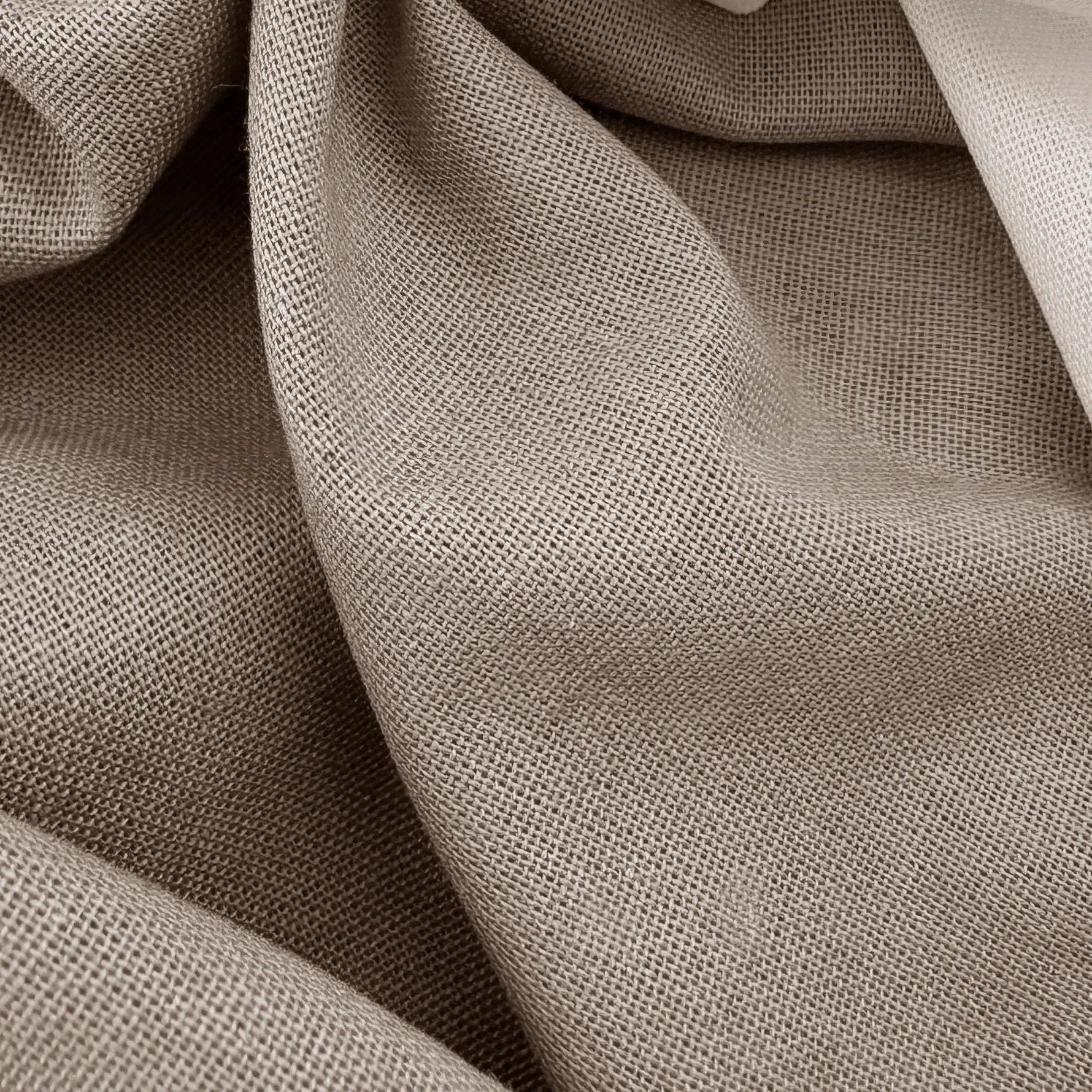 Close-up of beige fabric with a textured pattern