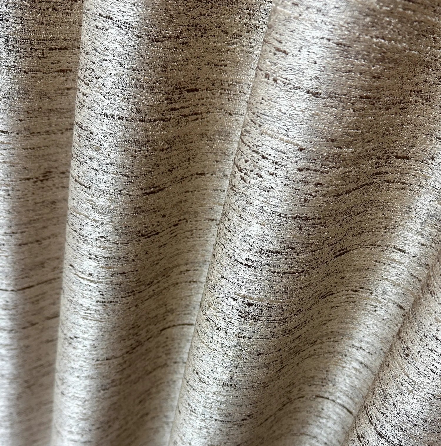 Close-up of textured fabric with a neutral color palette