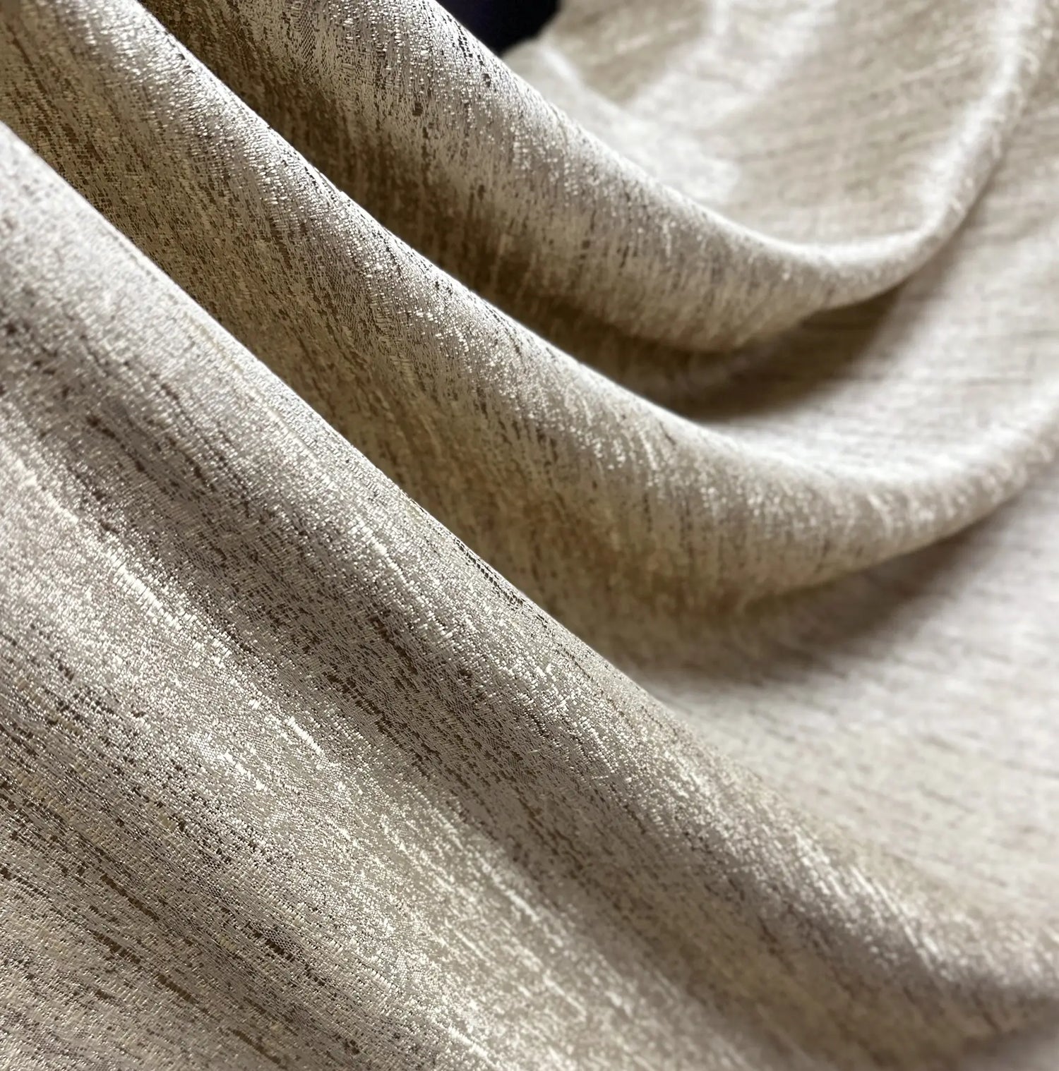 Close-up of beige fabric with a textured pattern