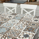 Tablecloth with decorative tile pattern on a table in a kitchen setting