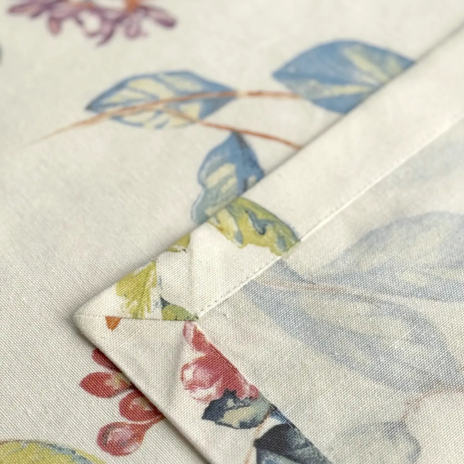Close-up of floral fabric swatches with a patchwork pattern.