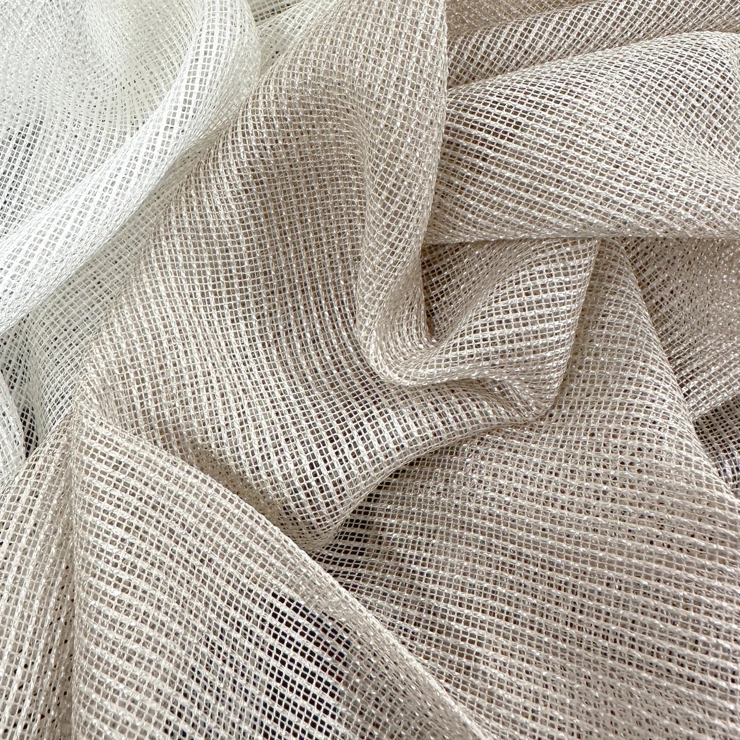 Close-up of beige textured fabric pet friendly curtains
