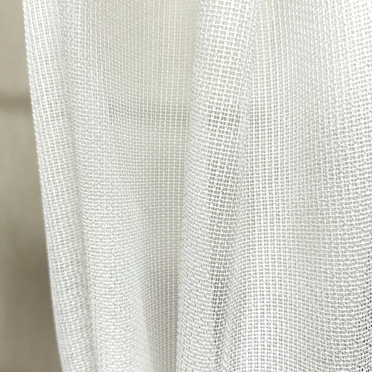 Close-up of a textured white pet friendly curtain
