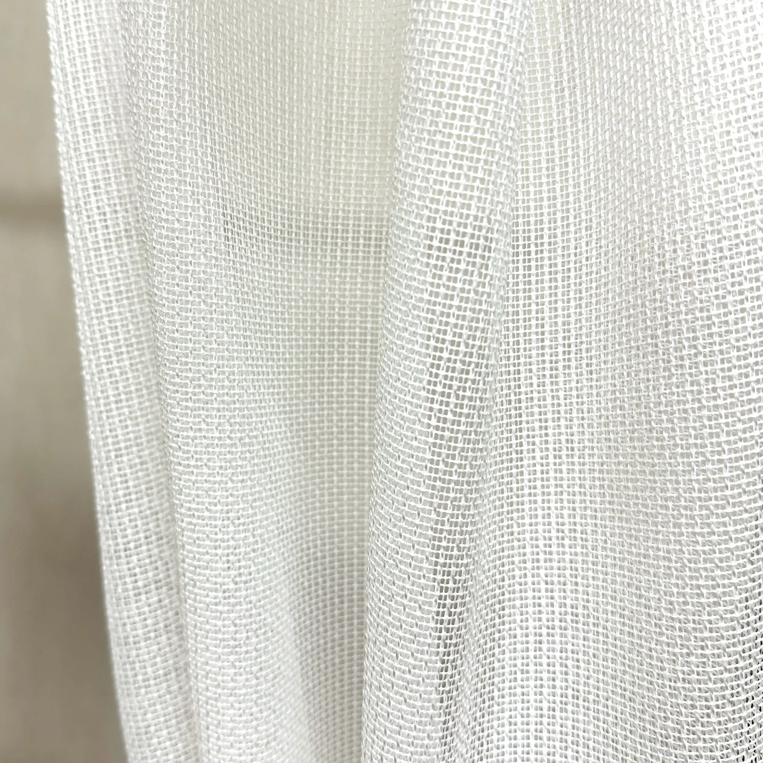 Close-up of a textured white pet friendly curtain