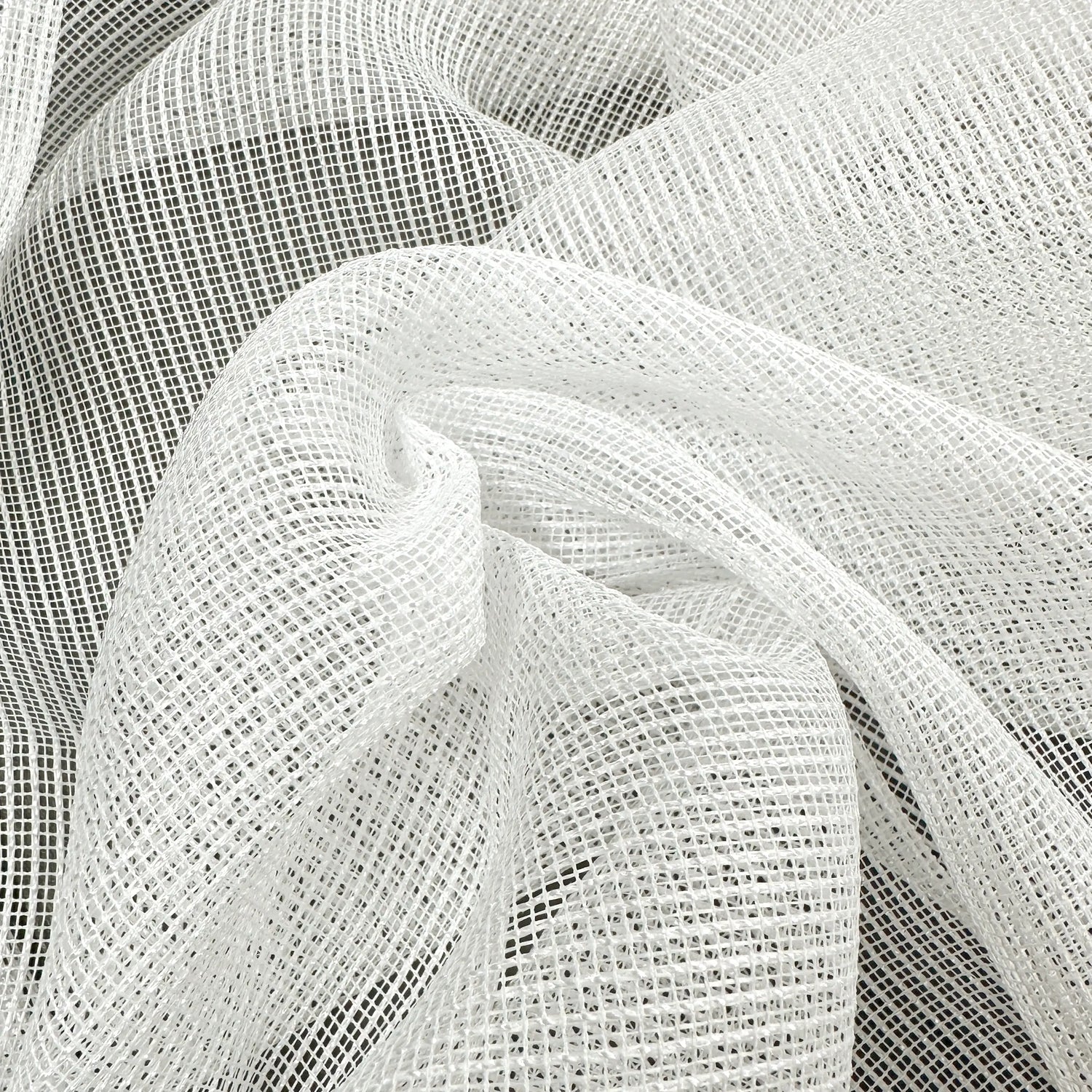 Close-up of white mesh curtains fabric with a grid pattern