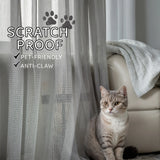 Cat sitting next to a scratch-proof pet-friendly curtain