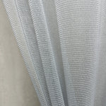 Close-up of a textured gray curtains fabric scratch proof on a neutral background