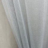 Close-up of a textured gray curtains fabric scratch proof on a neutral background