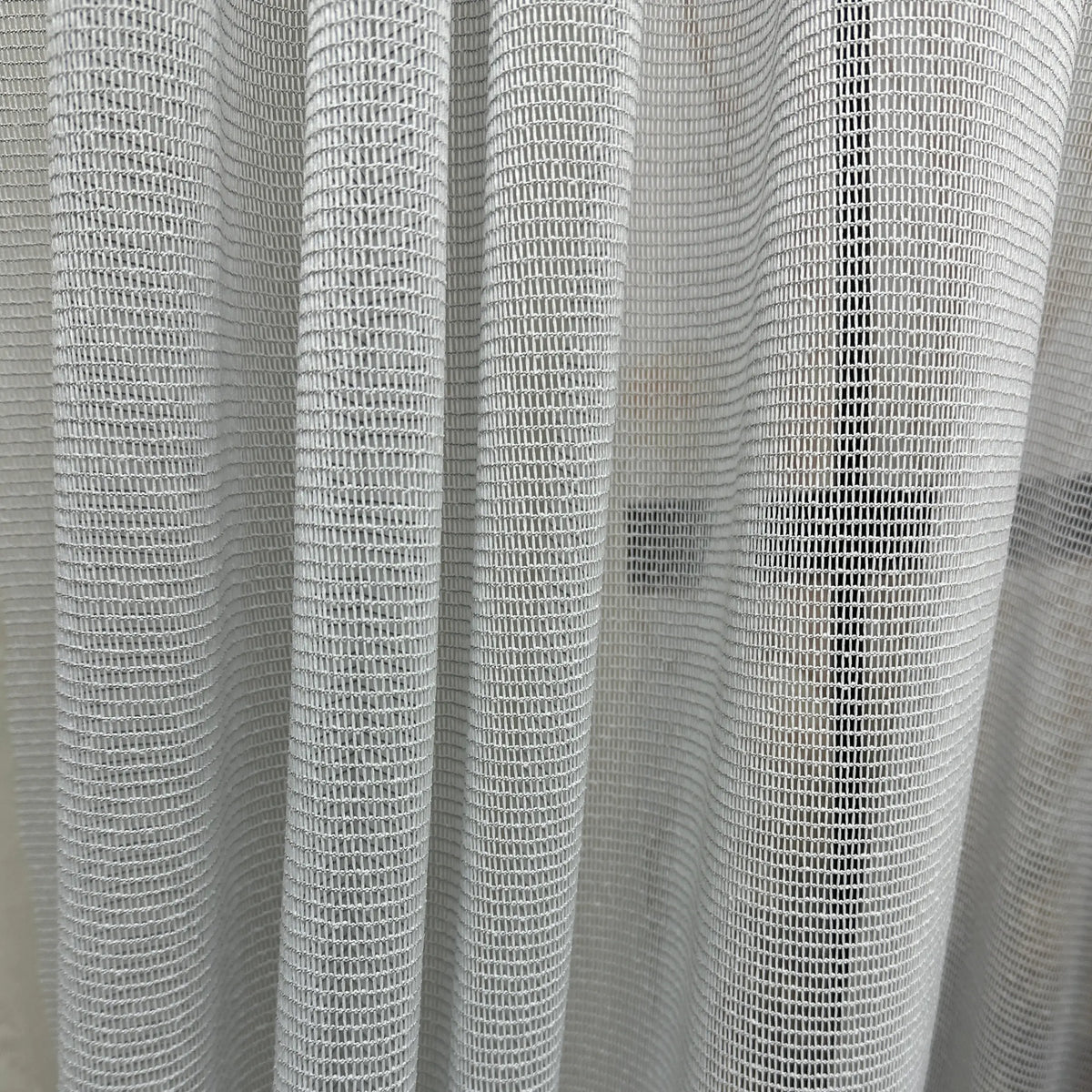 Close-up of a textured gray curtain pet friendly