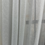 Close-up of a textured gray curtain pet friendly