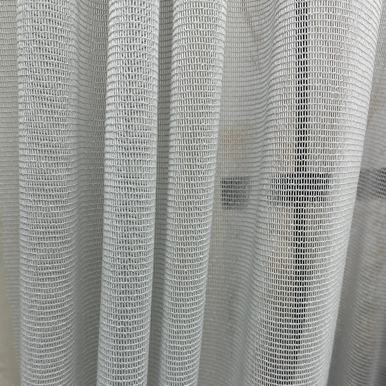 Close-up of a textured gray curtain pet friendly