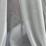Close-up of gray fabric with a textured pattern scratch proof