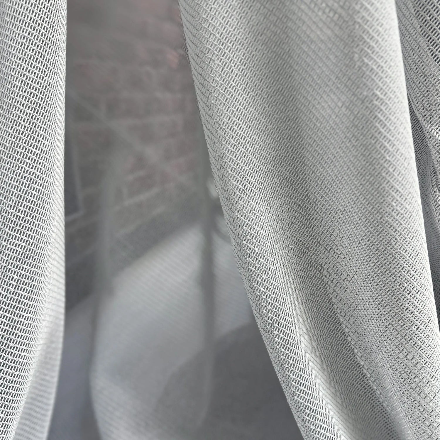 Close-up of gray fabric with a textured pattern scratch proof