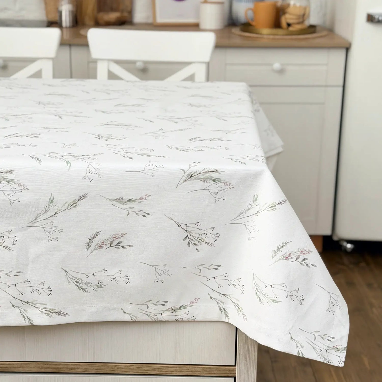 Floral-patterned tablecloth on a dining table in a kitchen setting