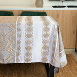 Tablecloth with geometric pattern on a dining table in a kitchen setting