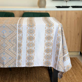 Tablecloth with geometric pattern on a dining table in a kitchen setting