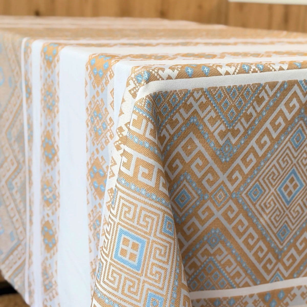 Patterned tablecloth with geometric design on a wooden table