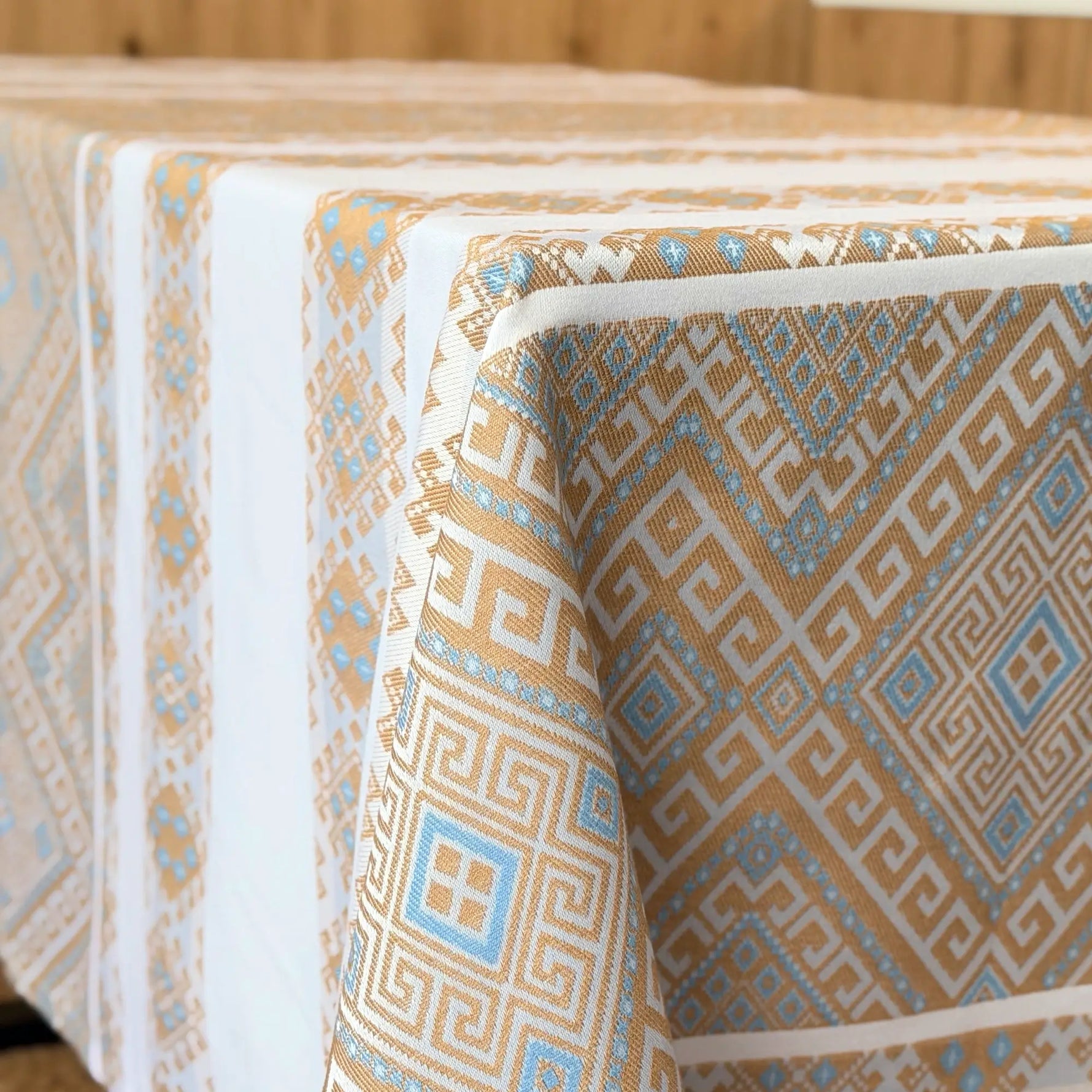 Patterned tablecloth with geometric design on a wooden table